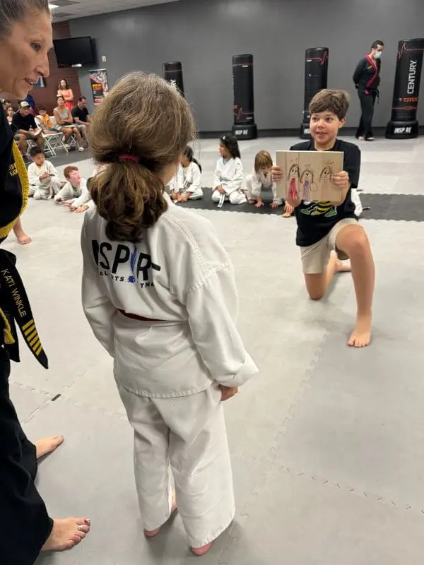 kids martial arts class demonstrating focus and respect